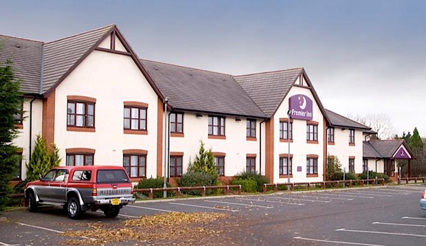Exterior of Premier Inn Carlisle hotel with car park